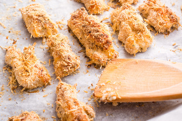 Homemade nuggets from chicken on a baking sheet