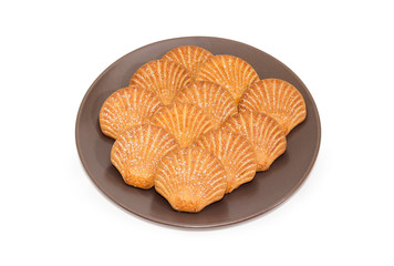 Cookies in the form of a shells on brown dish