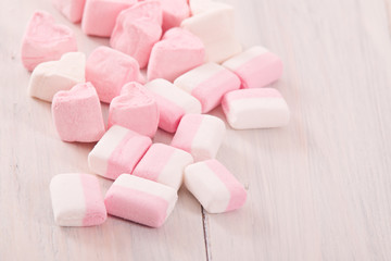 Marshmallows on wooden table. 