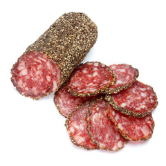 Dried organic salami sausage covered with pepper on white background