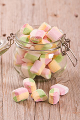 Marshmallows on wooden table. 