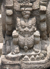 Fototapeta na wymiar Ancient stone bas-relief, Buddist temple Borobudur, Yogyakarta