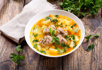 bowl of soup with meatballs and vegetables