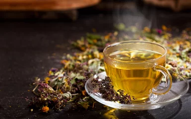 Printed kitchen splashbacks Tea Cup of herbal tea with various herbs
