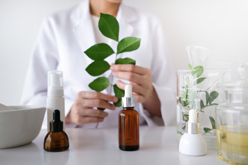 the scientist,doctor, make alternative herb medicine with herbal the organic natural in the laboratory. oil capsule, natural organic skincare and cosmetic.