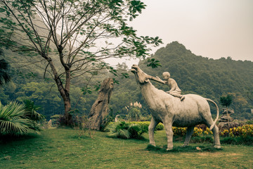 a statue of cattle with a farmer in vietnam
