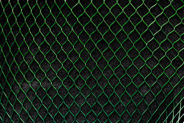 Green Vertical Net on the Black Background