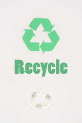 top view of light bulbs with recycle sign on white