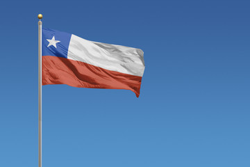 Flag of Chile in front of a clear blue sky