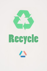top view of batteries with recycle sign on white