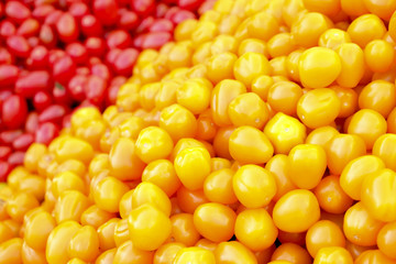 Clean eating concept. Bunch of ripe juicy fresh organic yellow red cherry mixed tomatoes pile at local produce farmers market. Healthy diet, spring summer detox. Vegan raw food. Close up, background.