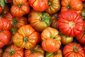 Clean eating concept. Bunch of ripe juicy fresh organic yellow green cherry mixed tomatoes pile at local produce farmers market. Healthy diet, spring summer detox. Vegan raw food. Close up, background