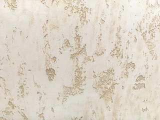 Texture decorative beige plaster imitating the old peeling wall.