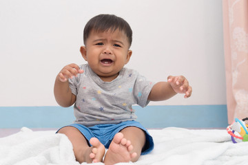 Fototapeta premium Cute baby unhappy and crying