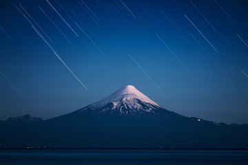 Volcano of Osorno and starry sky with trails. Chile