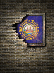 Old New Hampshire flag in brick wall