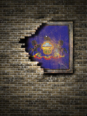 Old Pennsylvania flag in brick wall