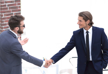 welcome and handshake of business partners