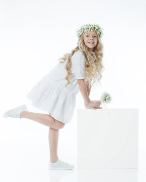 Beautiful girl with a wreath 