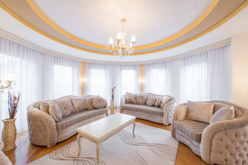 Interior of a luxury, open plan, living room with round, circle, ceiling