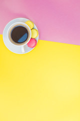 Flat lay of coffee cup with macaroons