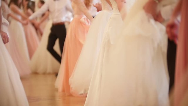 Dancing young people at the historical ball, slow-motion