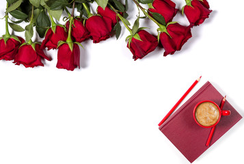 Romantic mockup. Beautiful bunch of large red roses, book, color pencils and small cup of coffee on white background. Space for your text. Top view.