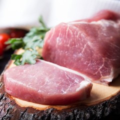 Raw meat  on a cutting board. Pork