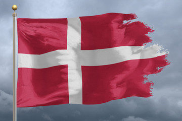Fototapeta premium Denmark Flag with torn edges in front of a stormy sky