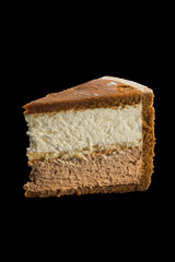 piece of delicious cake with chocolate and vanilla cream
