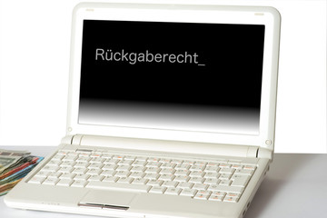 Ein Computer, Euro Geldscheine und das Rückgaberecht