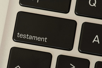 Ein Computer und eine Taste für Testament
