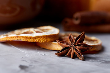 Homemade rose bread, cup of tea, dried citrus and spicies on white textured background, close-up, shallow depth of field