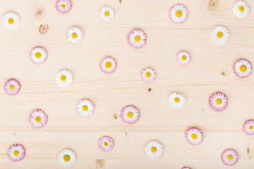 floral pattern made of garden flowers chrysanthemums on wooden rustic table background. vintage card, flat lay, top view. summer floral concept