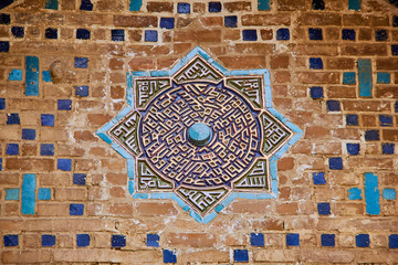 Geometric decoration of Islamic architecture. Detail of mosaic of ceramic tiles in Registan Square. Samarkand, Uzbekistan.