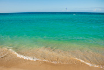 Tourists relax on Varadero sandy beach.Paradise landscape with turquoise sea and white sand. Cuba
