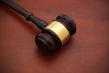 Gavel on wooden table with room for text