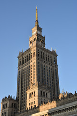 Fototapeta na wymiar Palace of Culture and Science in sunset light with shadows of other highrises, Warsaw city, Poland, landmark from communist era.