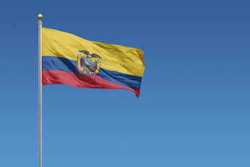 Flag of Ecuador in front of a clear blue sky
