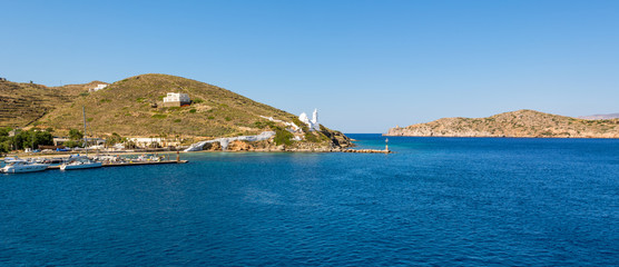 Fototapeta premium Panoramic view of blue sea water of Aegean Sea surrounded by beautiful coast of Island of Ios. Greece.