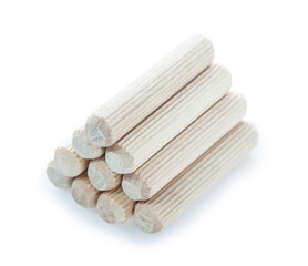 New wooden dowels isolated on white