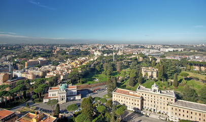 Fototapeta premium View on the vatican gardens and the city of Rome from top of the St. Peter's Basilica. Vatican, Rome, italy.