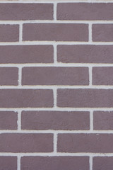 Texture of a brick violet wall