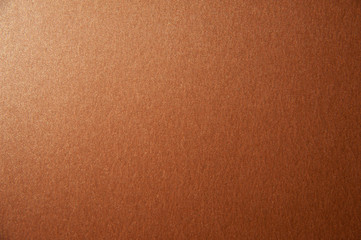 Texture of bronze brown glitter paper background. Macro photo