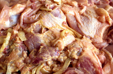marinated pieces of chicken meat for cooking on coals