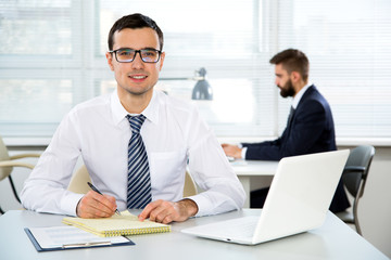 Young businessman working in an office