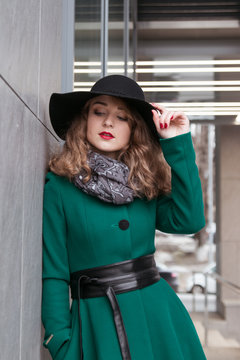 Girl In Green Coat And Black Hat