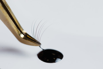 Eyelash Extension tools on white background. Accessories for eyelash extensions. Artificial lashes.