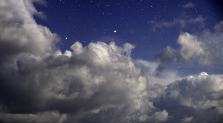 Cloudy night with stars