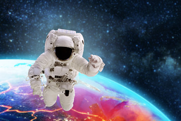 astronaut flies over the earth in space. Elements of this image furnished by NASA